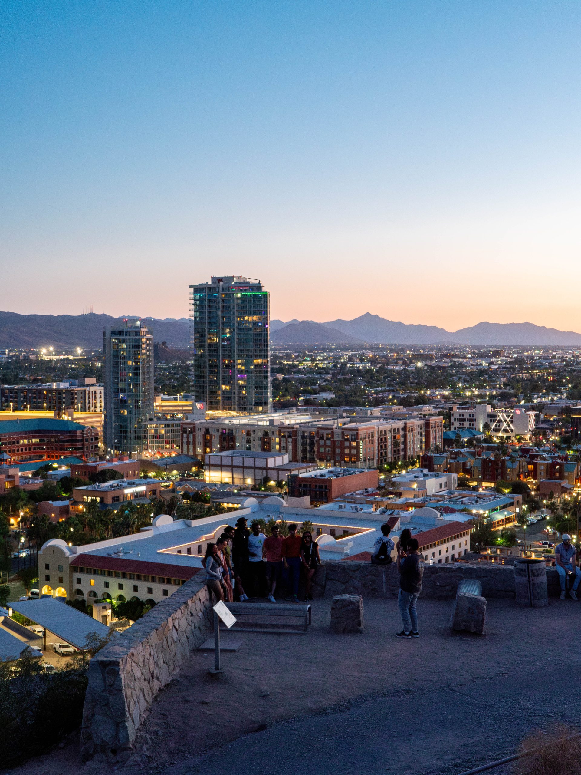 Image of Tempe from the Tempe Butte at night. The West 6 towers are visible as are a mountain range.